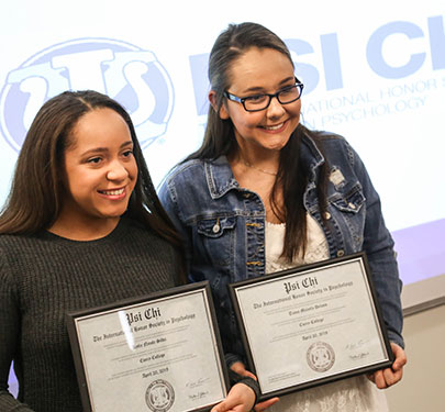 Curry College students receive their Psychology Honor Society certificates