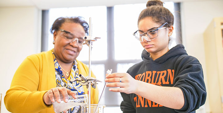 Curry College student and faculty member collaborate on a science experiment