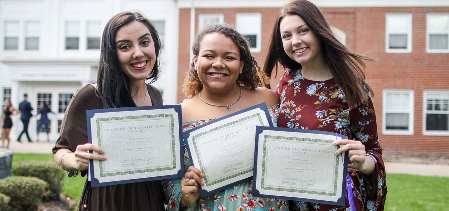 Curry College students receive their Alexander Graham Bell Honor Society membership certificates