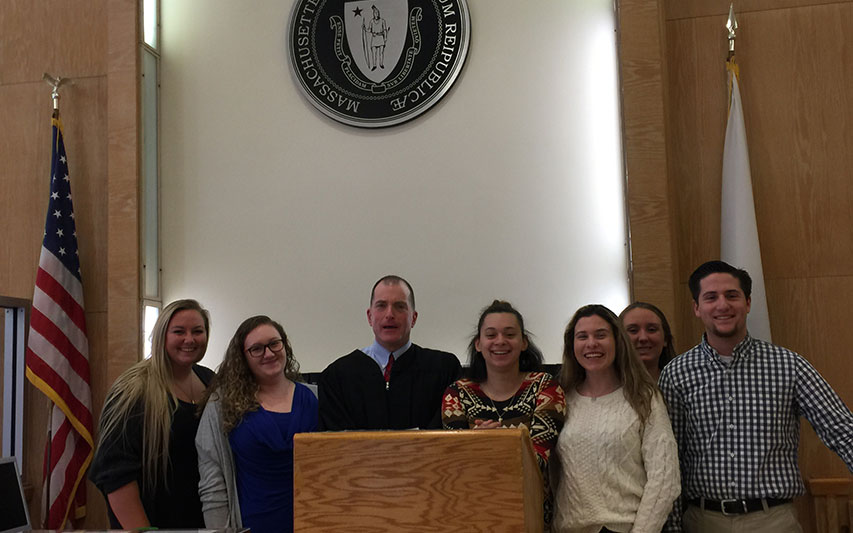 Criminal Justice students inside Stoughton District Court with First Justice Richard Savignano