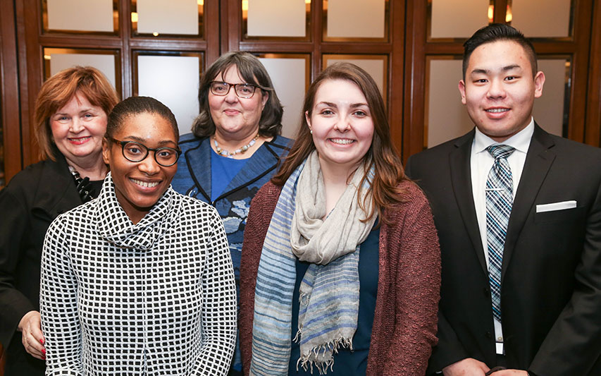 Trustee Joyce A. Murphy, Hon. '99, MPA and Katherine Hesse, Esq., pose with students at Women's Leadership Council event. 