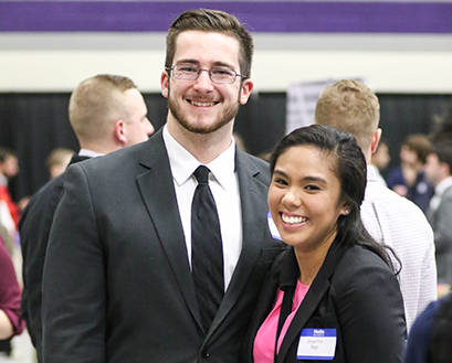 Students smile and pose for a photo at the Career and Internship Fair