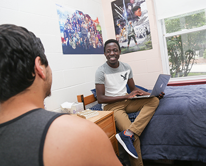Students hang out in a residence hall room