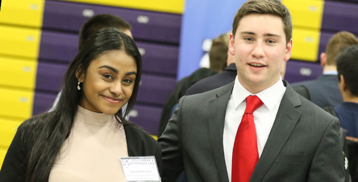 Recent Curry College graduates dressed for success and recruitment