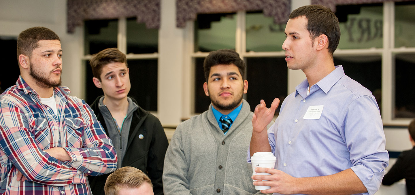 A Curry College alumnus gives career advice to students as part of a Center for Career Development Networking event