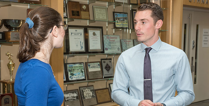 A Curry College alumnus gives career advice to a student as part of a Center for Career Development Networking event
