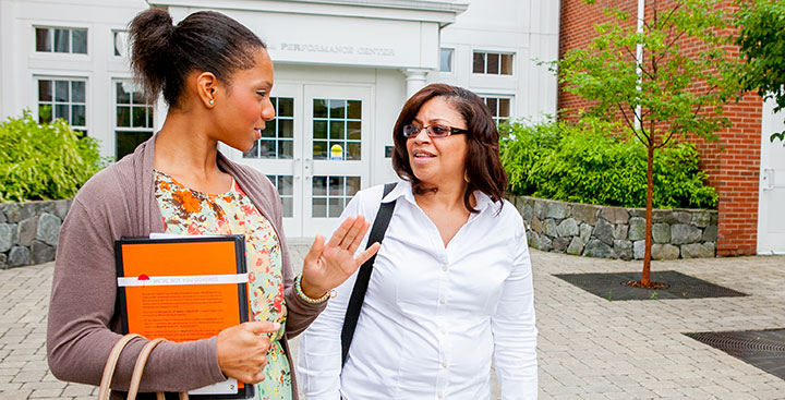 Students in a Curry College Continuing Education program walk on campus