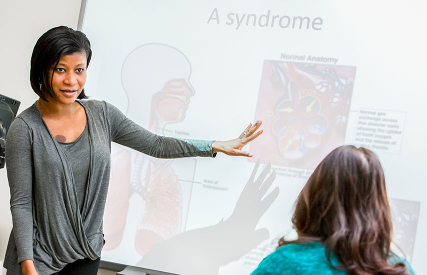 A Curry College Master of Science in Nursing Degree in Nursing Education student teaches a lesson to her cohort
