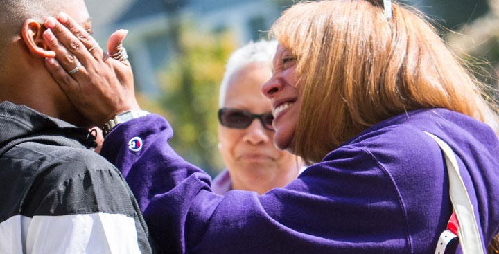 A Curry College First-Year parent hugs her son