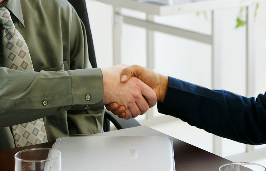 A hand shake after a job interview represents the human resources concentration at Curry College