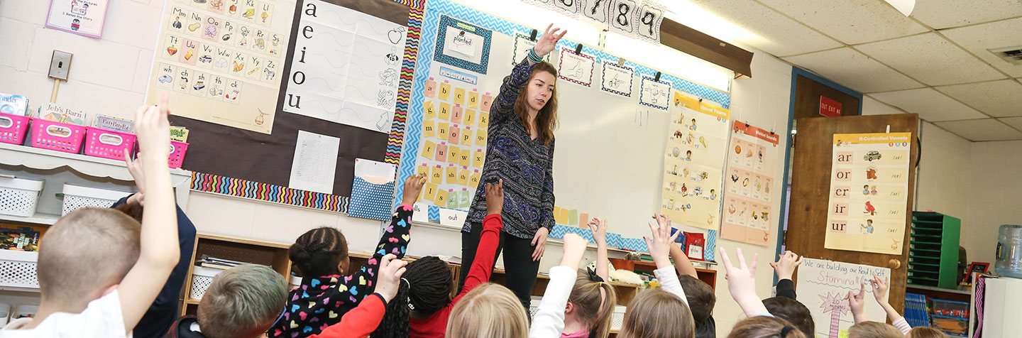 Curry College Education Degree alumna teaching in a local school classroom