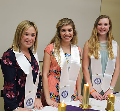 Curry College students receive their Education Honor Society certificate