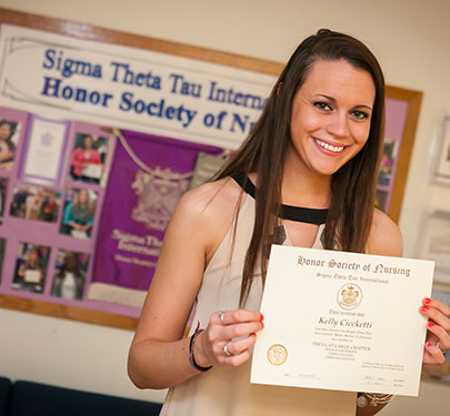 A student receives her Nursing Honor Society certificate