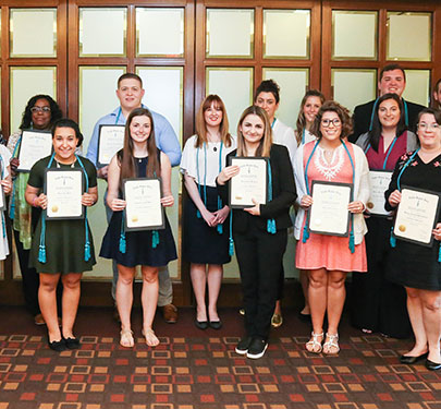 Curry College students receive their Sociology Honor Society certificate