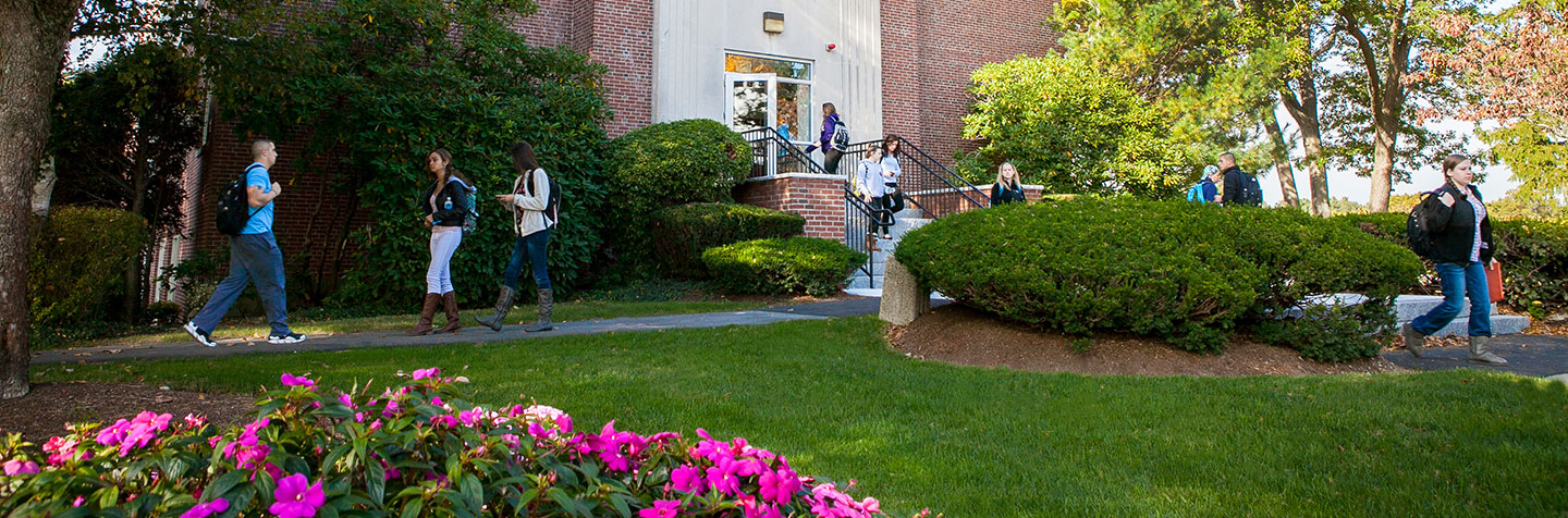 Students walking on campus at Curry College representing Explore Curry Days