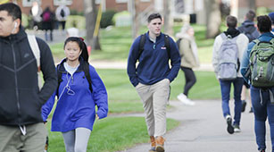 Students walking on campus at Curry College