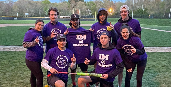 Curry College Intramural co-ed softball team poses for a pic