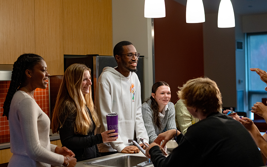 Students hang out at Bell Residence Hall at Curry College