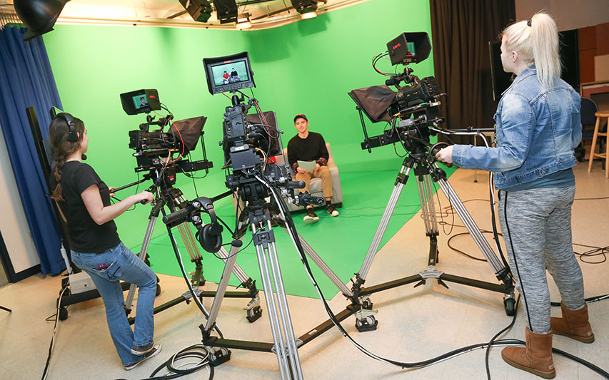 Students produce a newscast in Hirsh Communication Center