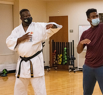 former New England Patriots All-Pro linebacker and NFL Hall of Famer Andre Tippett teaches the newly established Curry College Karate Club