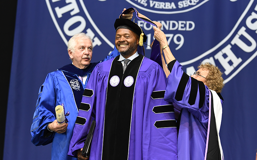 Michael Curry, Esq. is awarded an honorary Doctor of Business Administration degree from Curry College