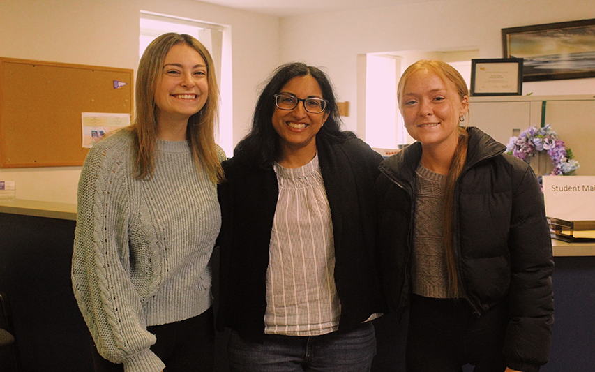 Dr. Khera poses with seniors who are helping her with research 