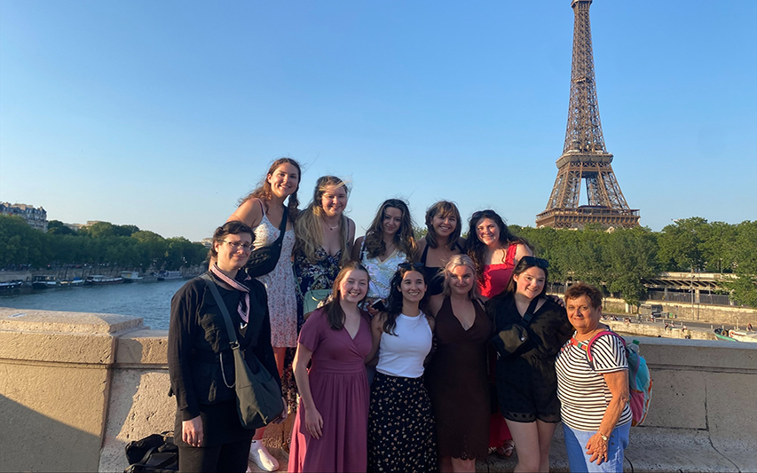 School of Nursing Students Pose in Front of Eiffel Tower