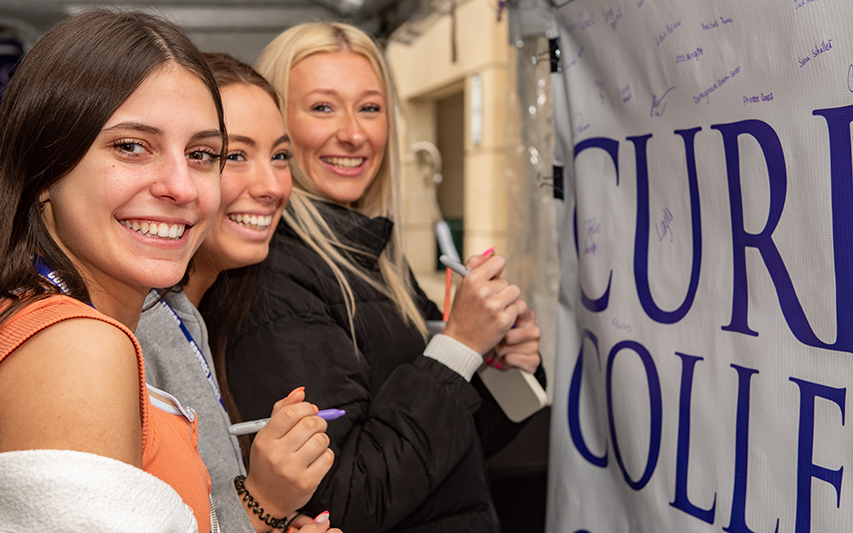 Students smile for a photo at Curry College Accepted Student Day