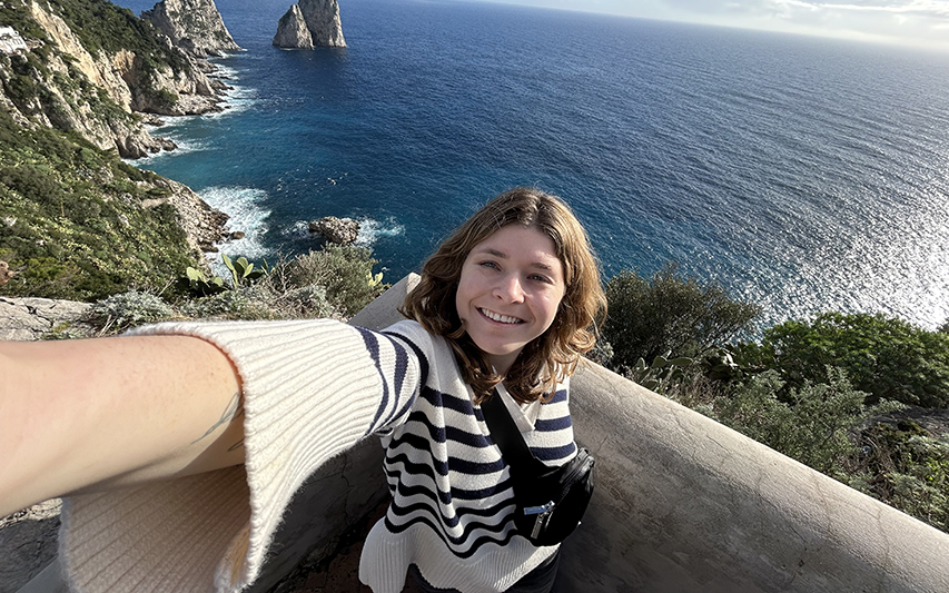 Cate Pierce takes a selfie in Sorrento, Italy overlooking the water
