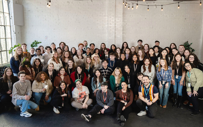 Students pose in group photo at Adobe Conference