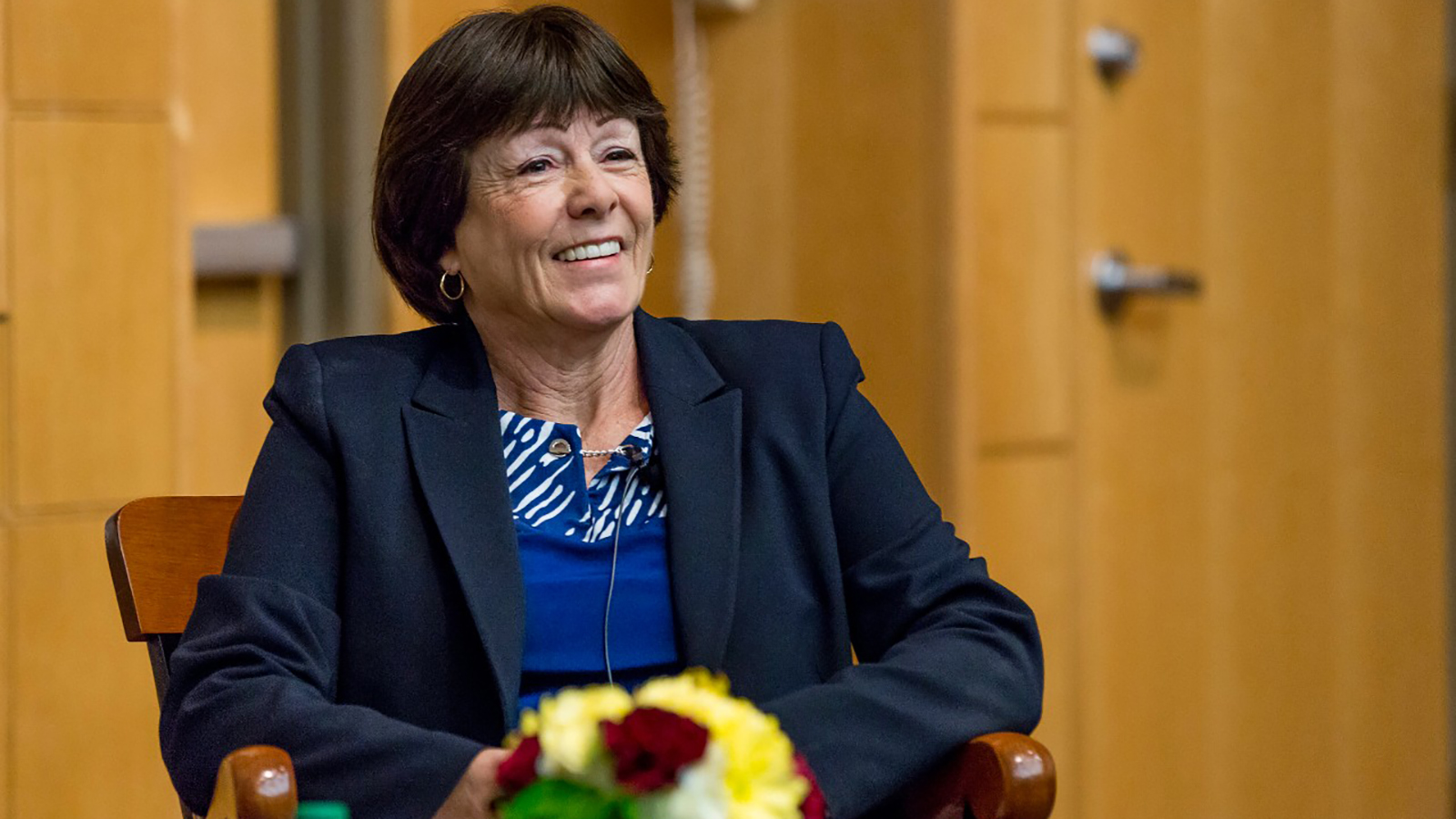 Dr. Karen Daley Smiles in Chair