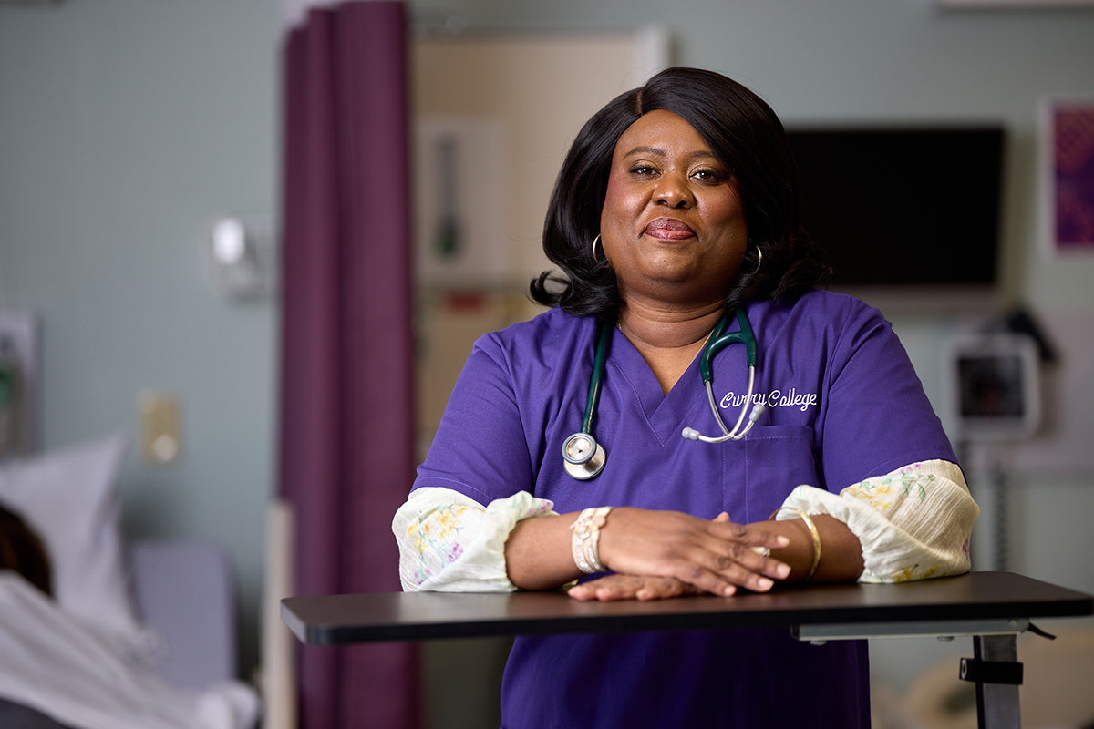 Racquel poses inside nursing sim lab