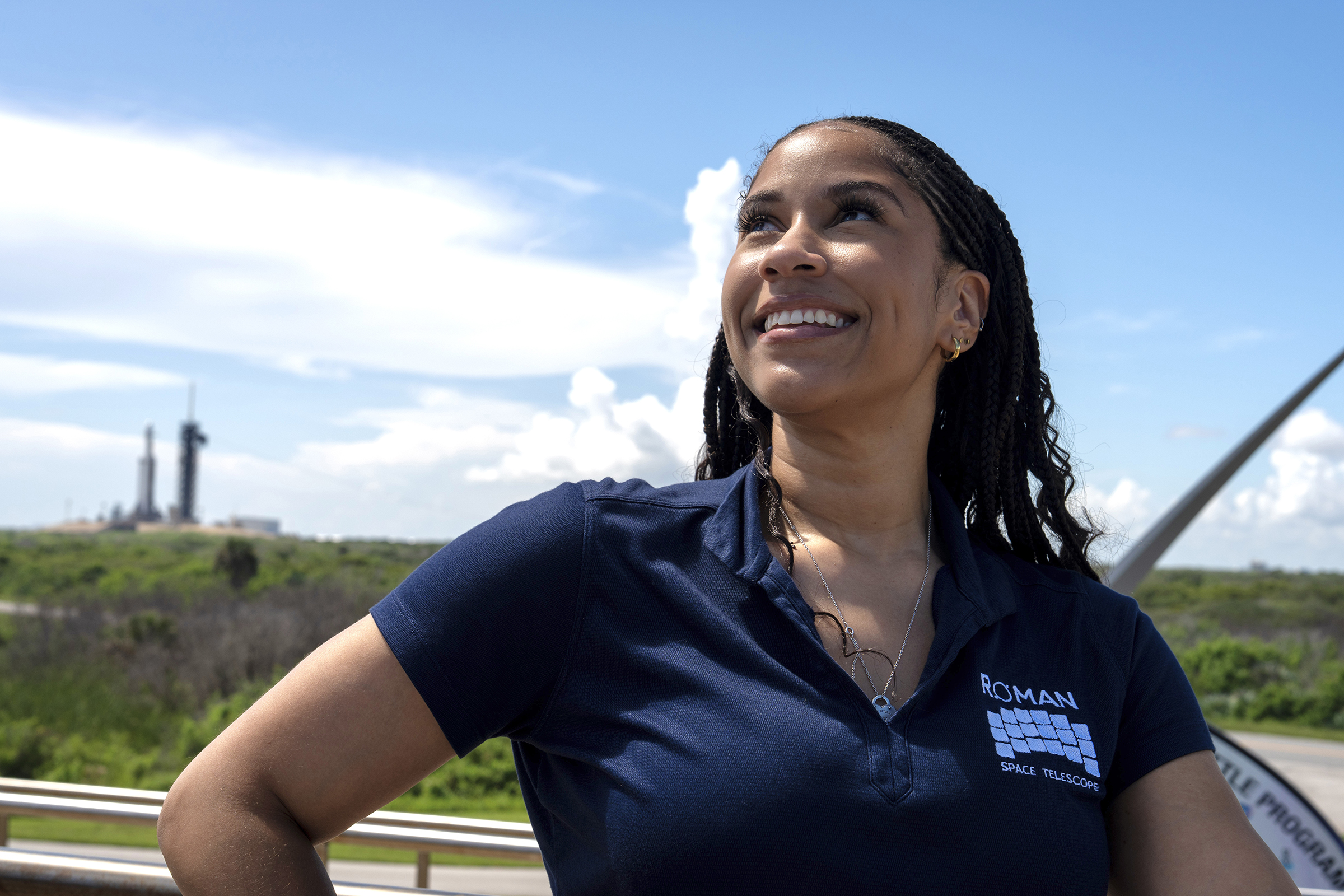 Courtney Lee looks up at the sky wearing roman telescope polo