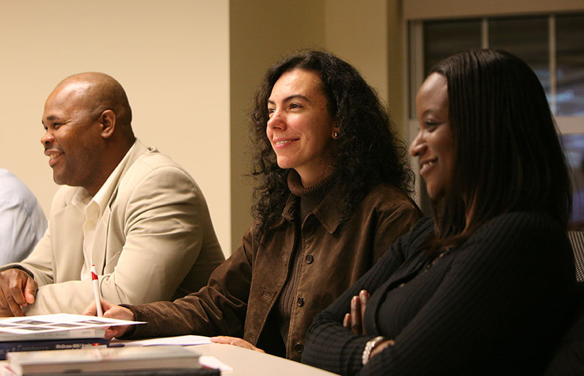 Curry College continuing education students in class engaged in a professional development course