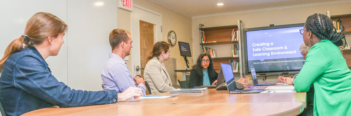 Curry College Faculty and Staff meet in the Faculty Center collaboration room