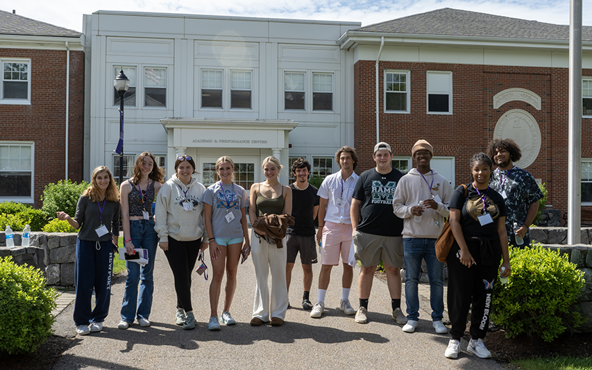 Students pose for a picture on the Curry College Academic Quad at Orientation