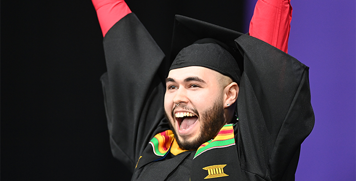 A graduate yells with joy at Curry College Commencement 2025
