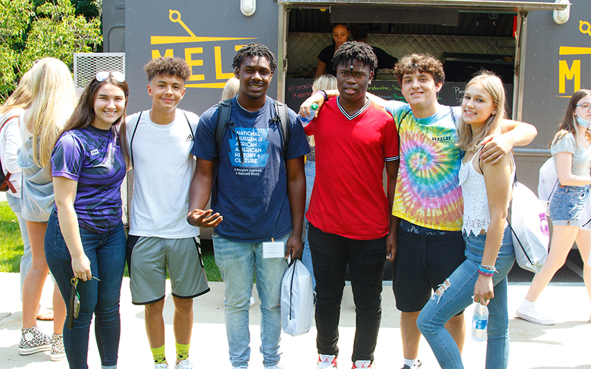 Students at Curry College Orientation pose for a photo