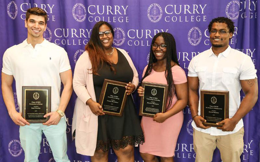 Curry College students pose with their awards at the Awards Ceremony.