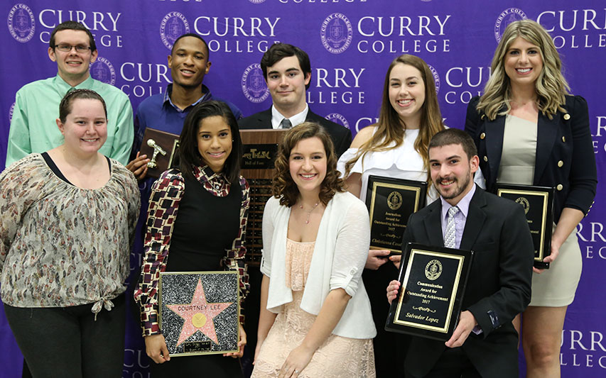 Students pose with their awards at Awards Day
