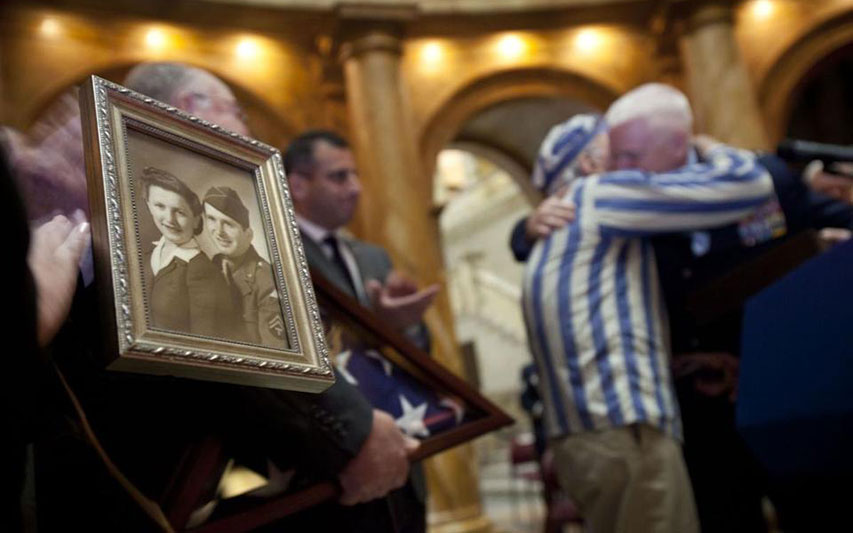 New England Holocaust Memorial founder Steve Ross embraces a loved one