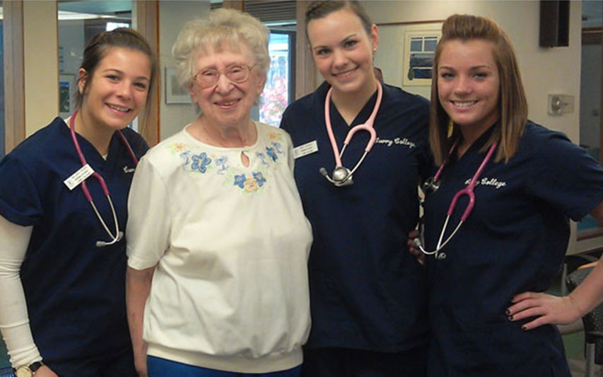 School of Nursing students with senior citizen.