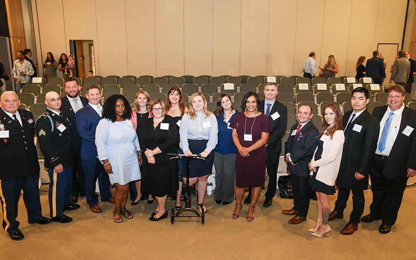 MBA students pose for photo after Capstone presentation