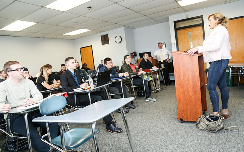 Michele McPhee adresses students in a Criminal Justice course. 