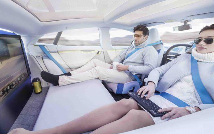 A slide from futurist Joe Barkai depicting a couple driving an autonomous vehicle