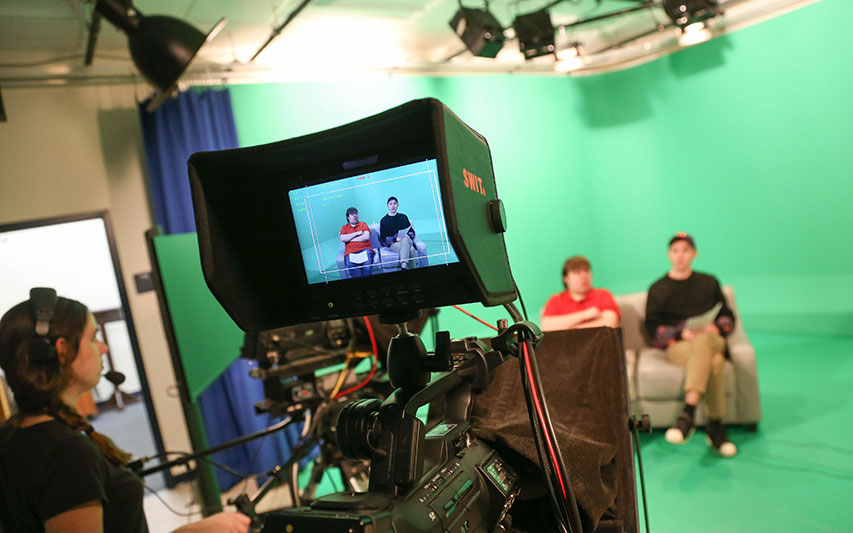 Curry College Communication Students filming a CC8 production