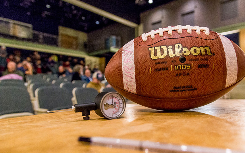 A football sits in the foreground as Students, Faculty Explore the Intersection of Science, Law, and Media with Deflategate Documentary Filmmakers