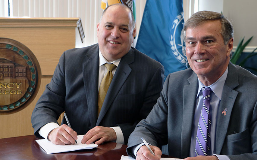 Quincy College President Michael G. Bellotti and Curry College President Kenneth K. Quigley, Jr.