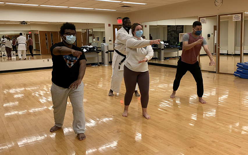 former New England Patriots All-Pro linebacker and NFL Hall of Famer Andre Tippett teaches the newly established Curry College Karate Club