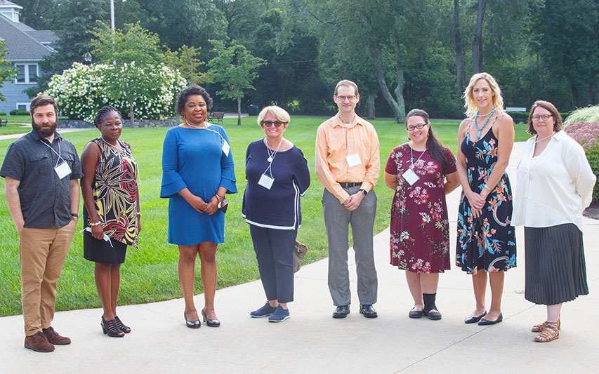 Curry College's newest faculty members for 2021-2022 pose for a group shot